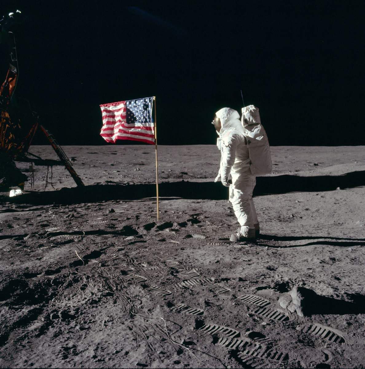 Buzz Aldrin salutes the deployed U.S. flag on the lunar surface