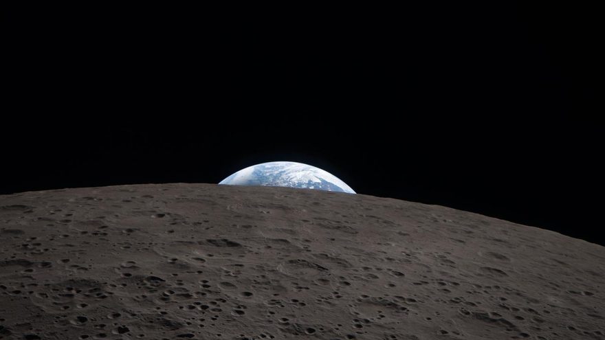 The Earth hanging at the lunar horizon — the moment before the drop