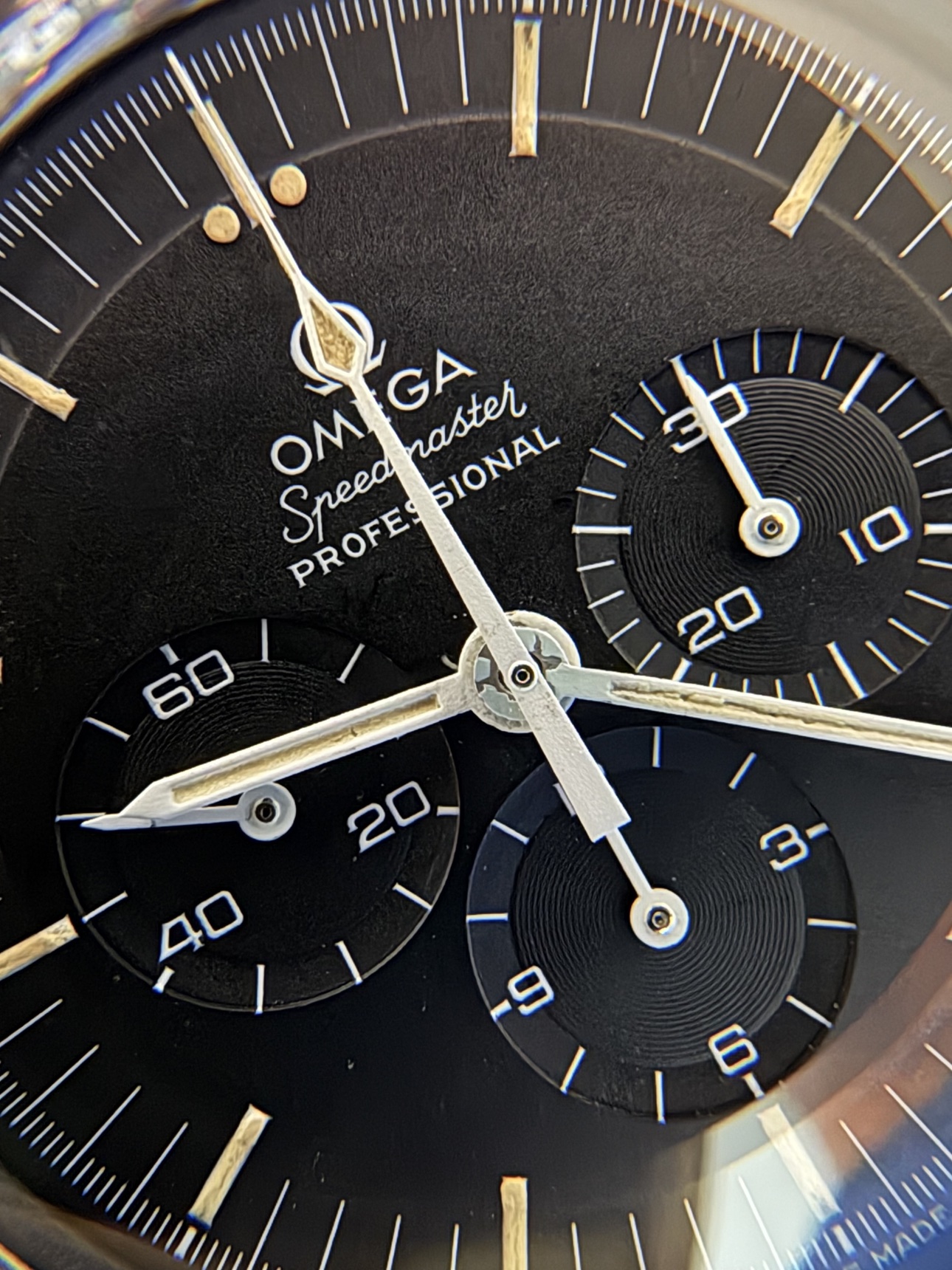 Macro of the collector's Speedmaster dial