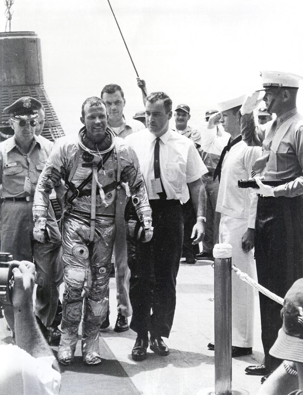 Gordon Cooper beside Faith 7 after the final Mercury flight, May 16, 1963