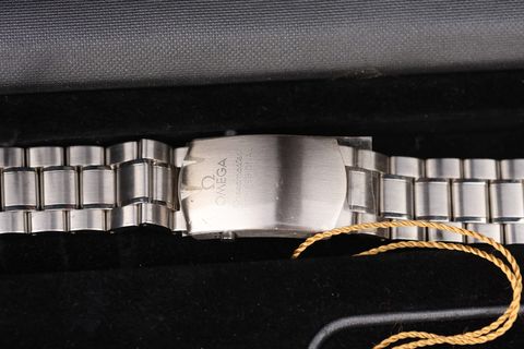 The unworn bracelet, clasp sticker intact