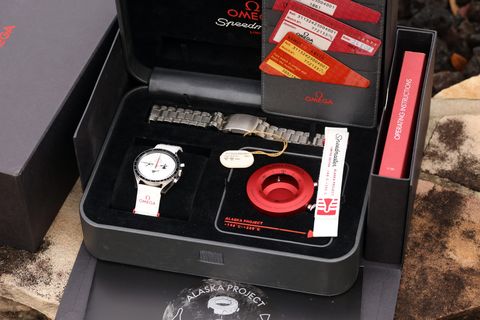 The full set as offered — boxes, papers, tools, straps
