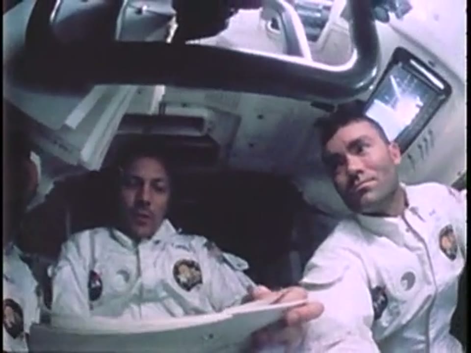 Two Apollo 13 crewmen in the lunar module cabin during the crisis