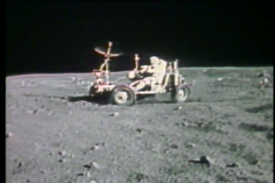The lunar rover kicking up dust during the lunar Grand Prix at Descartes