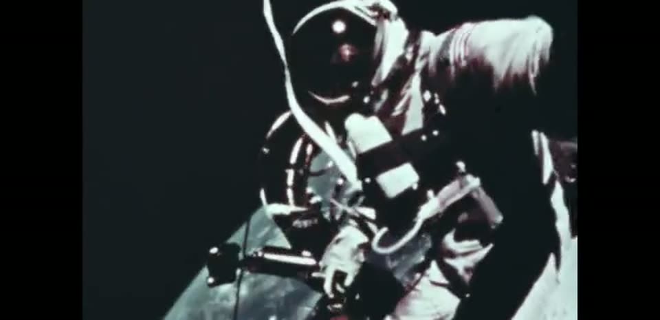 Astronaut Ed White floating outside Gemini IV above the Earth